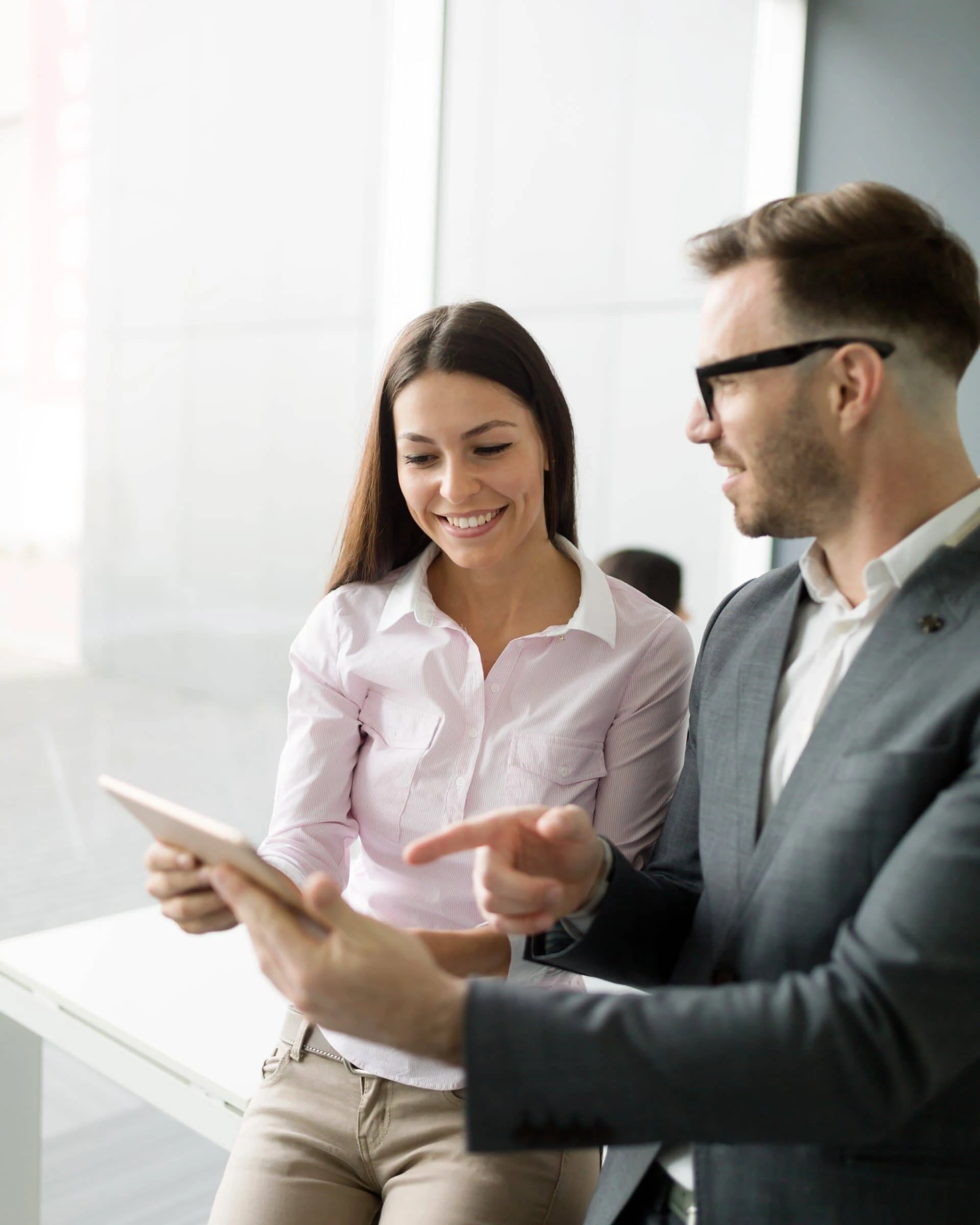 Colleagues talking in single office Zurich