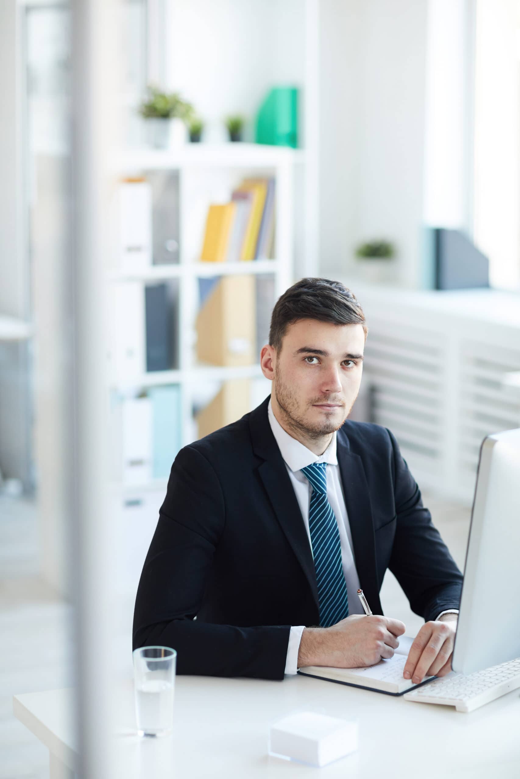 Man taking notes at his desk