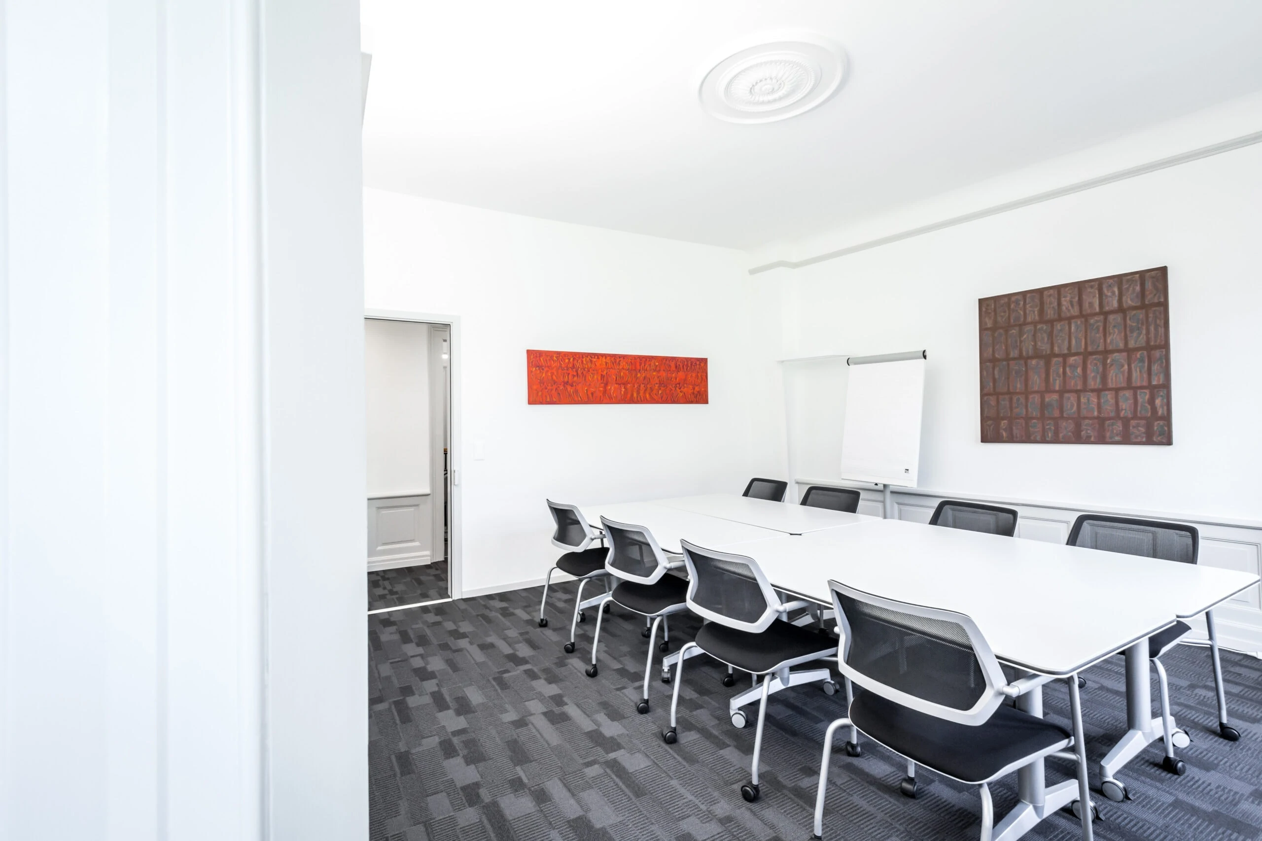 Bright meeting room with paintings on the wall