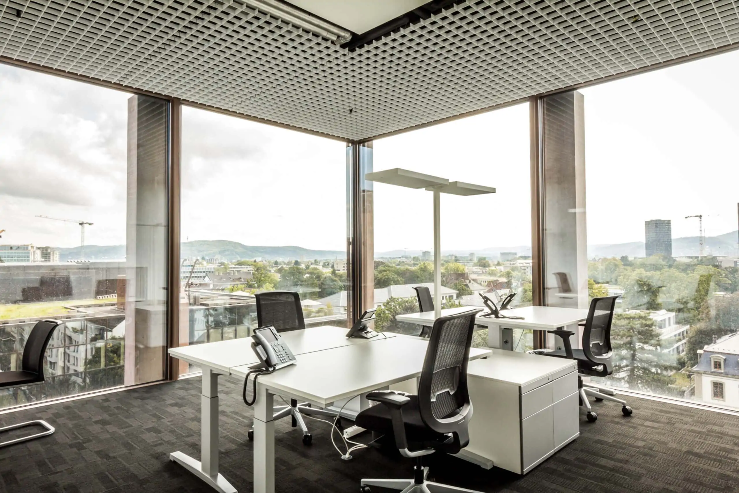 Team office with view of Basel and large window front