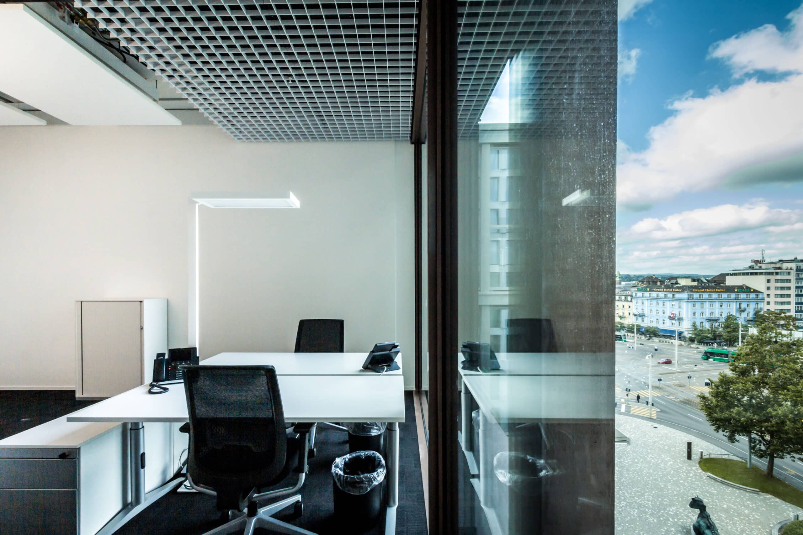 Bright office in Basel with a view of the city